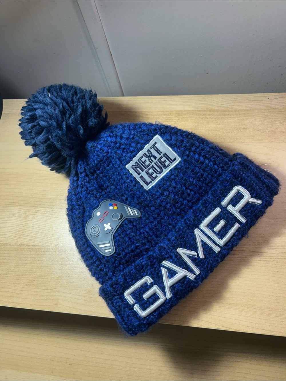 Place Blue Gamer Pom Beanie Hat with Game Controller Patch